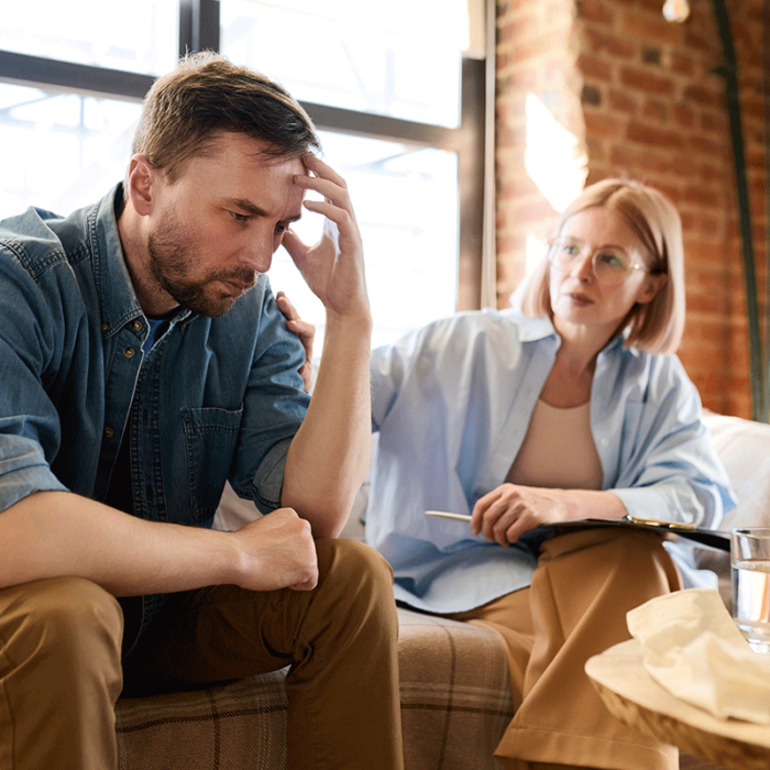 female therapist explaining to distressed young man what is the most common dual diagnosis