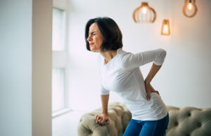 A woman struggles with muscle twitches.