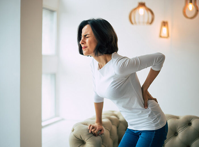 A woman struggles with muscle twitches.