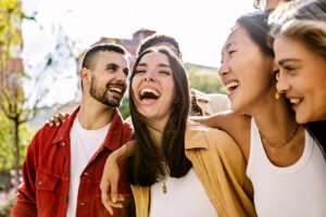 A group of sober people laugh together.