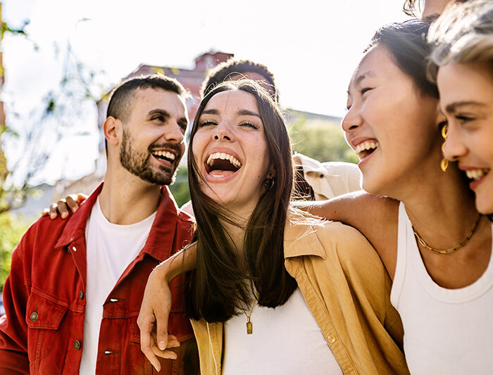 A group of sober people laugh together.