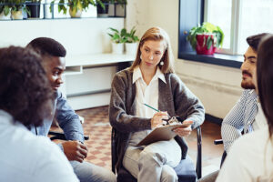 A group of people talk about Step One in an AA program.