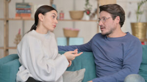 A woman talks to her spouse about his drinking.