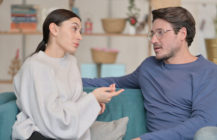 A woman talks to her spouse about his drinking.